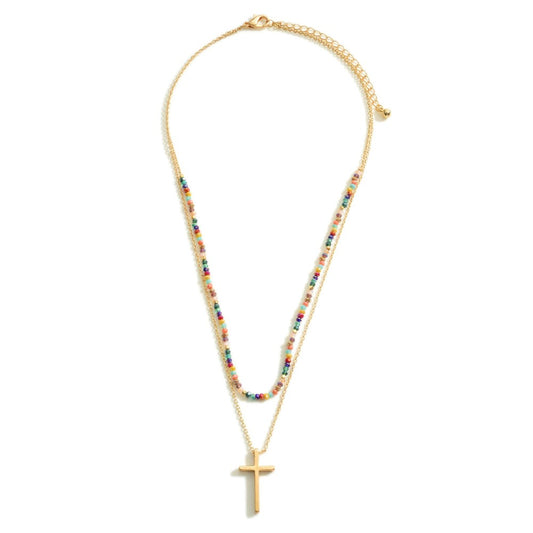 Layered Gold Necklace Featuring a Cross Pendant and Beaded Accents.